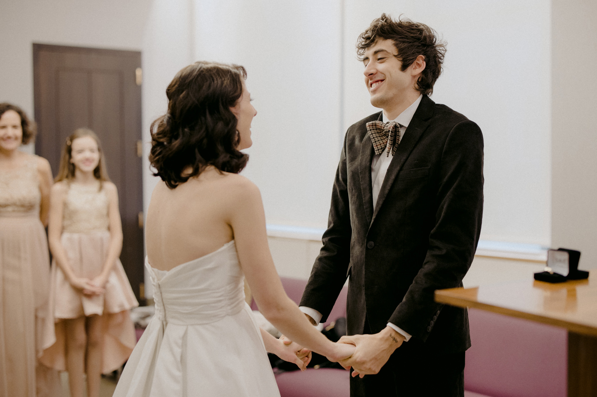 Couple exchanging vows at City Hall