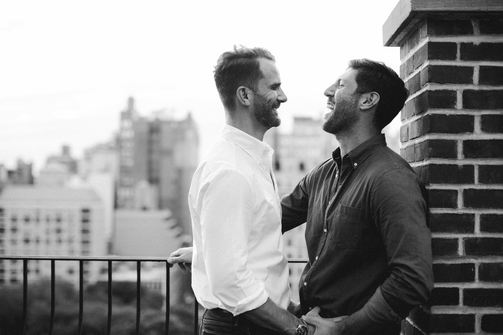 Couple laughing on rooftop in New York City
