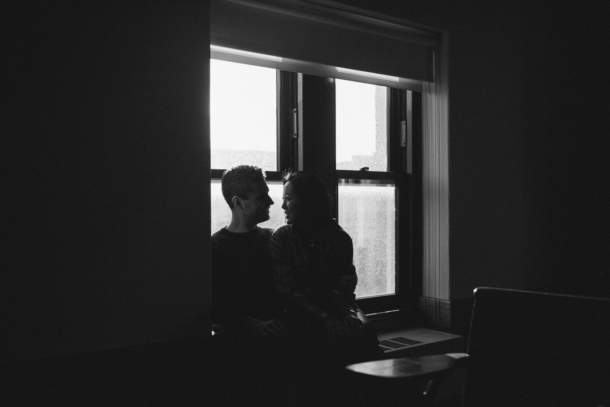 Couple in window at Columbia University classroom