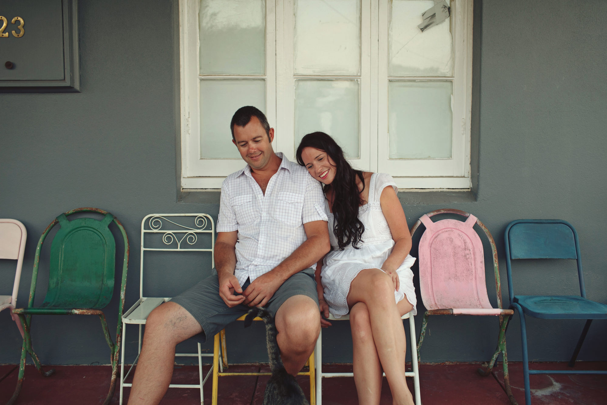 Couple sitting on their front porch