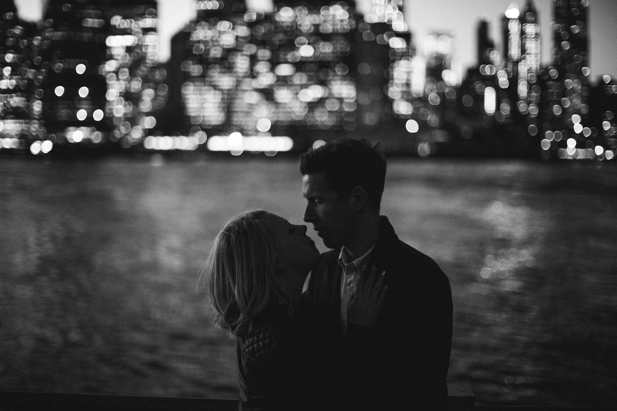 Couple at twilight with Manhattan skyline view