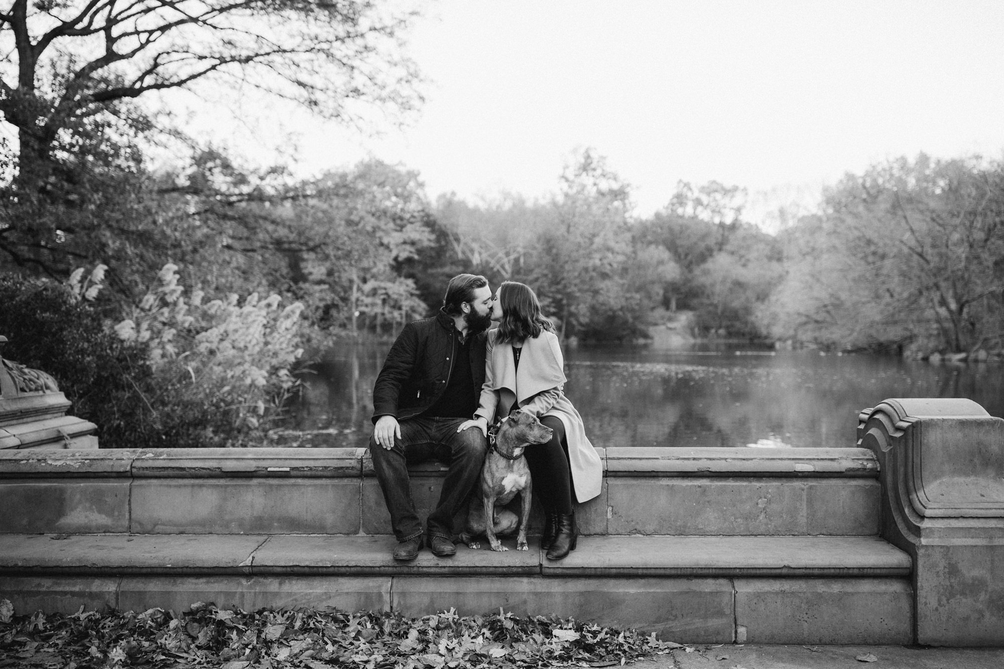 Couple kissing near The Lake in Central Park