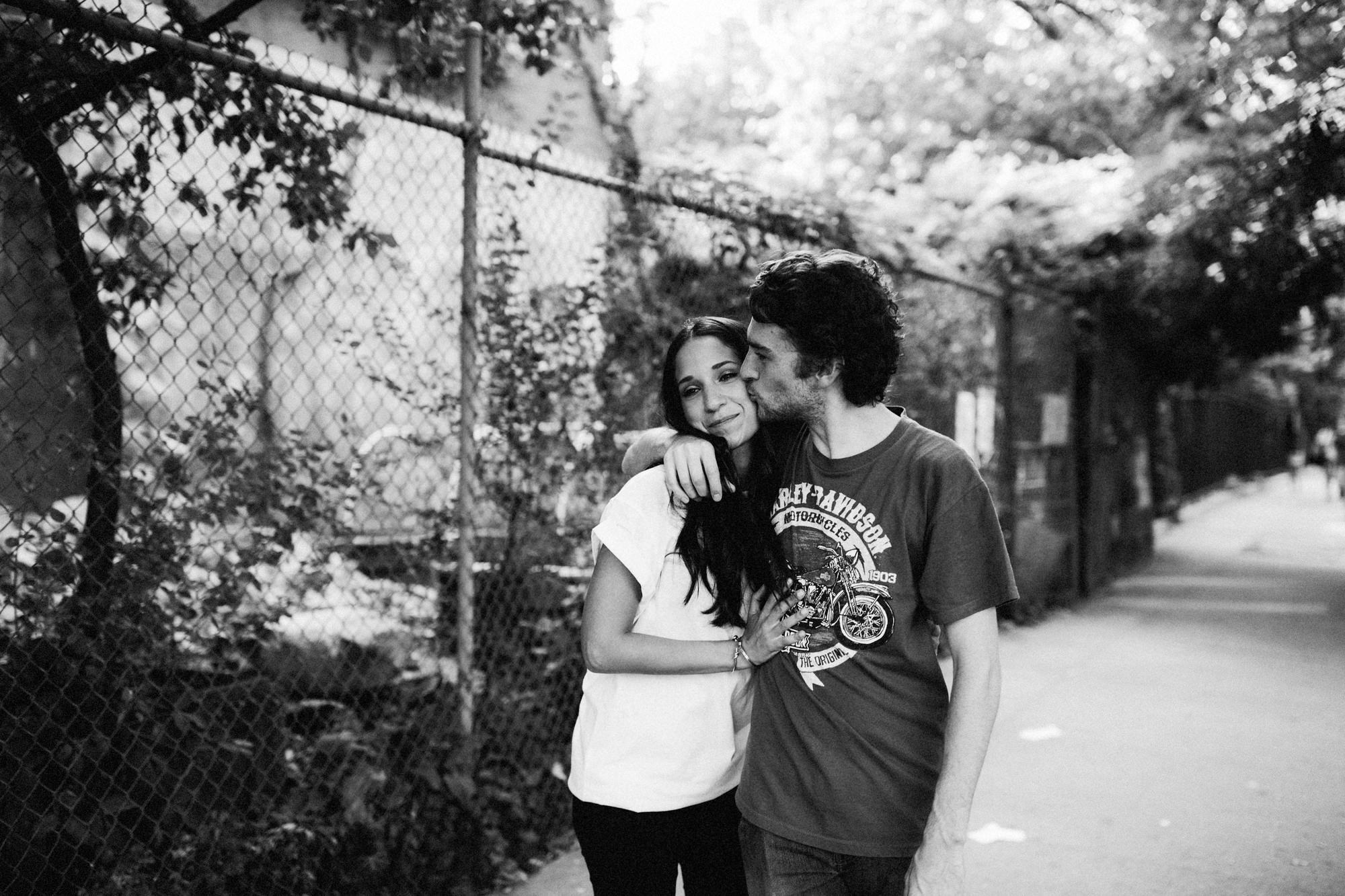 Man kissing woman in East Village portrait shoot