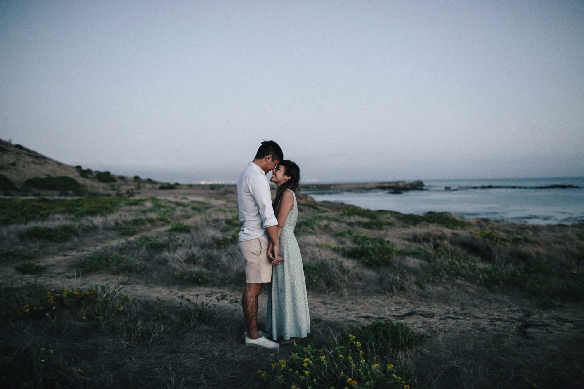 Couple at twilight on Highway 1 in California