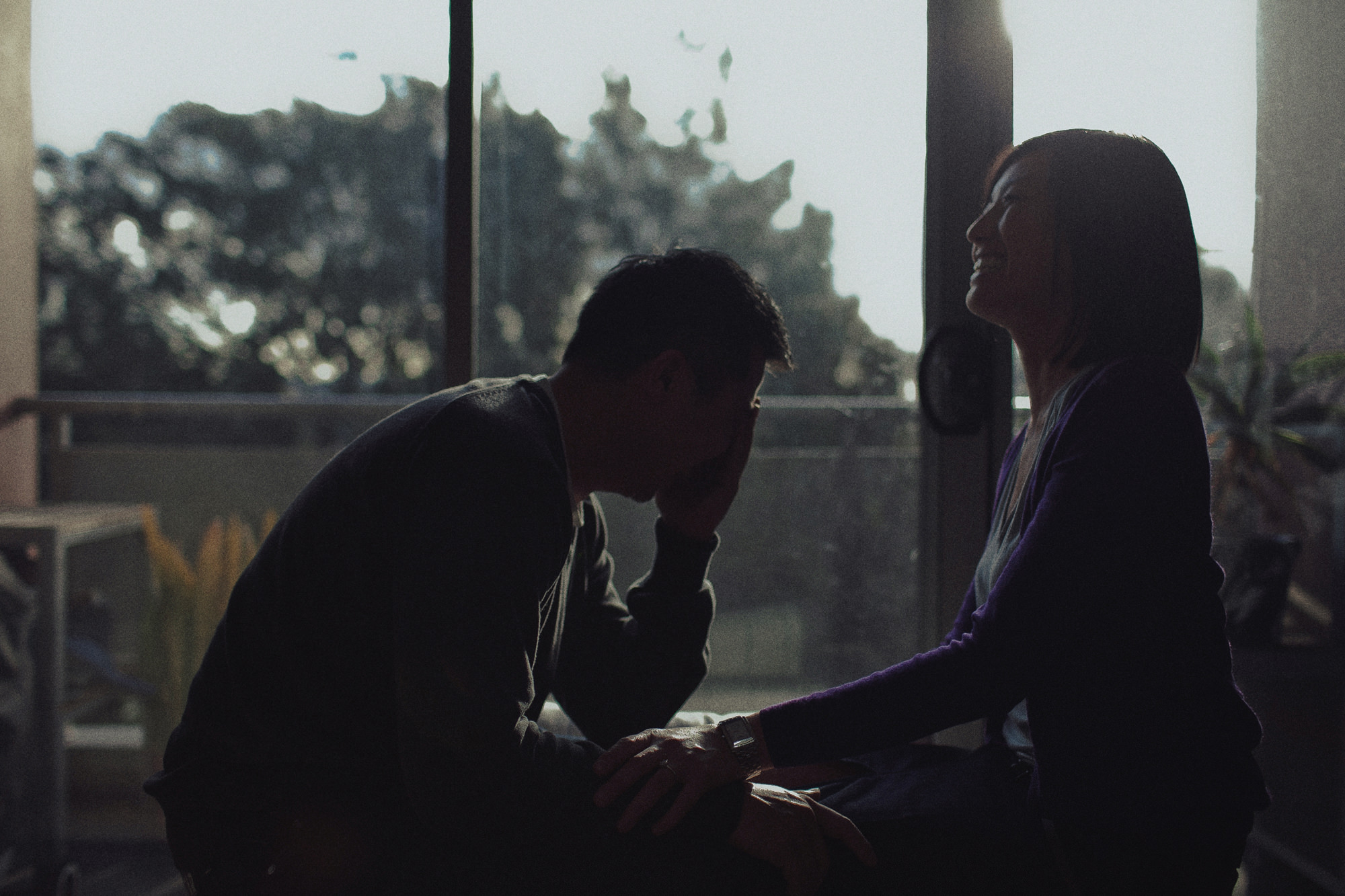 Couple laughing at home