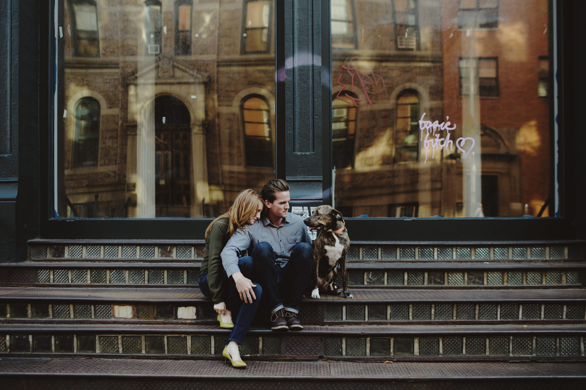 Couple with their dog sitting in Manhattan