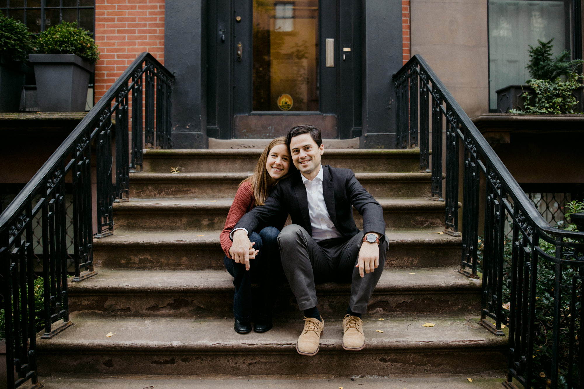 Couple sitting on stoop in Brooklyn Heights