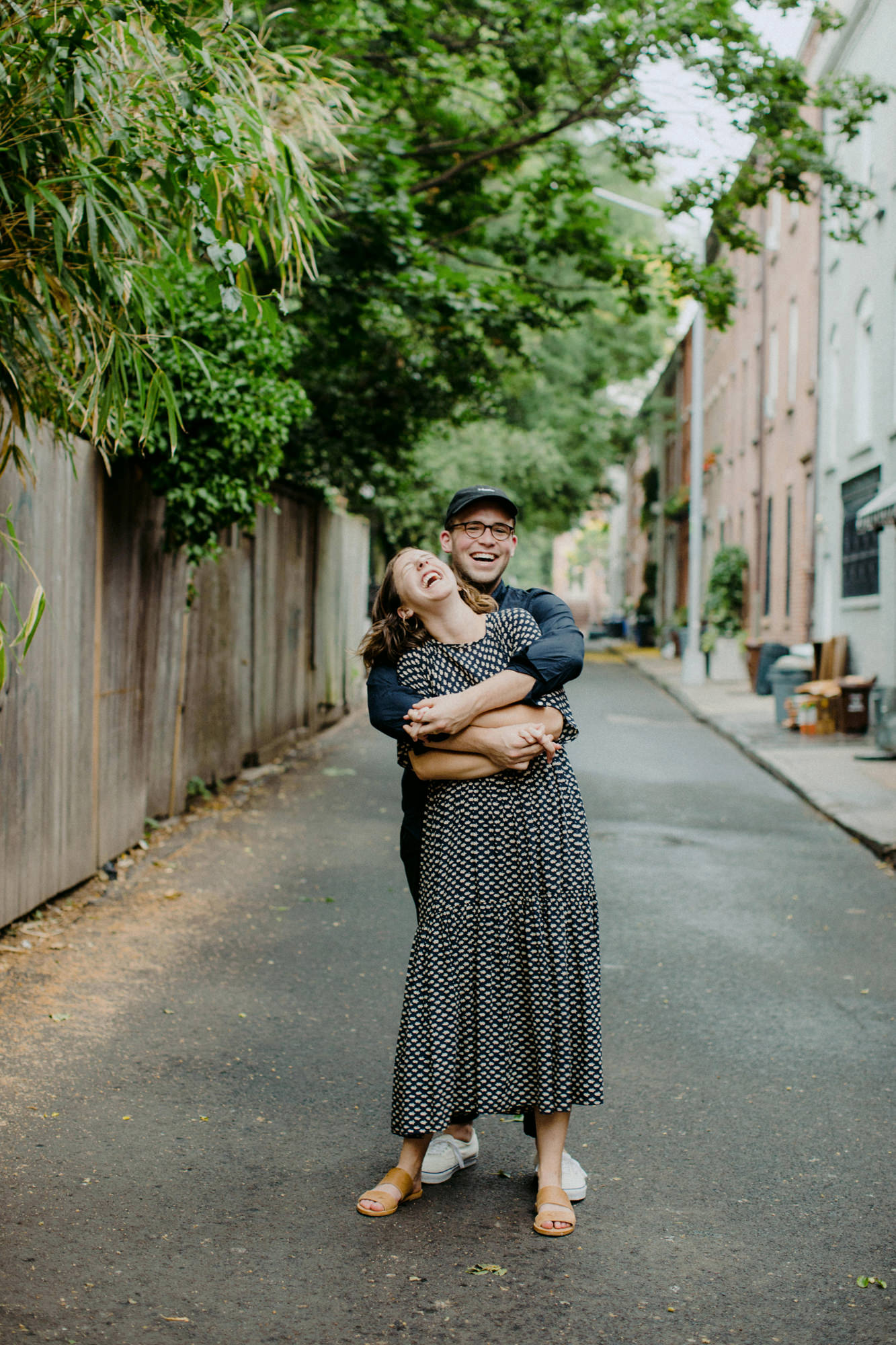 couple laughing in laneway