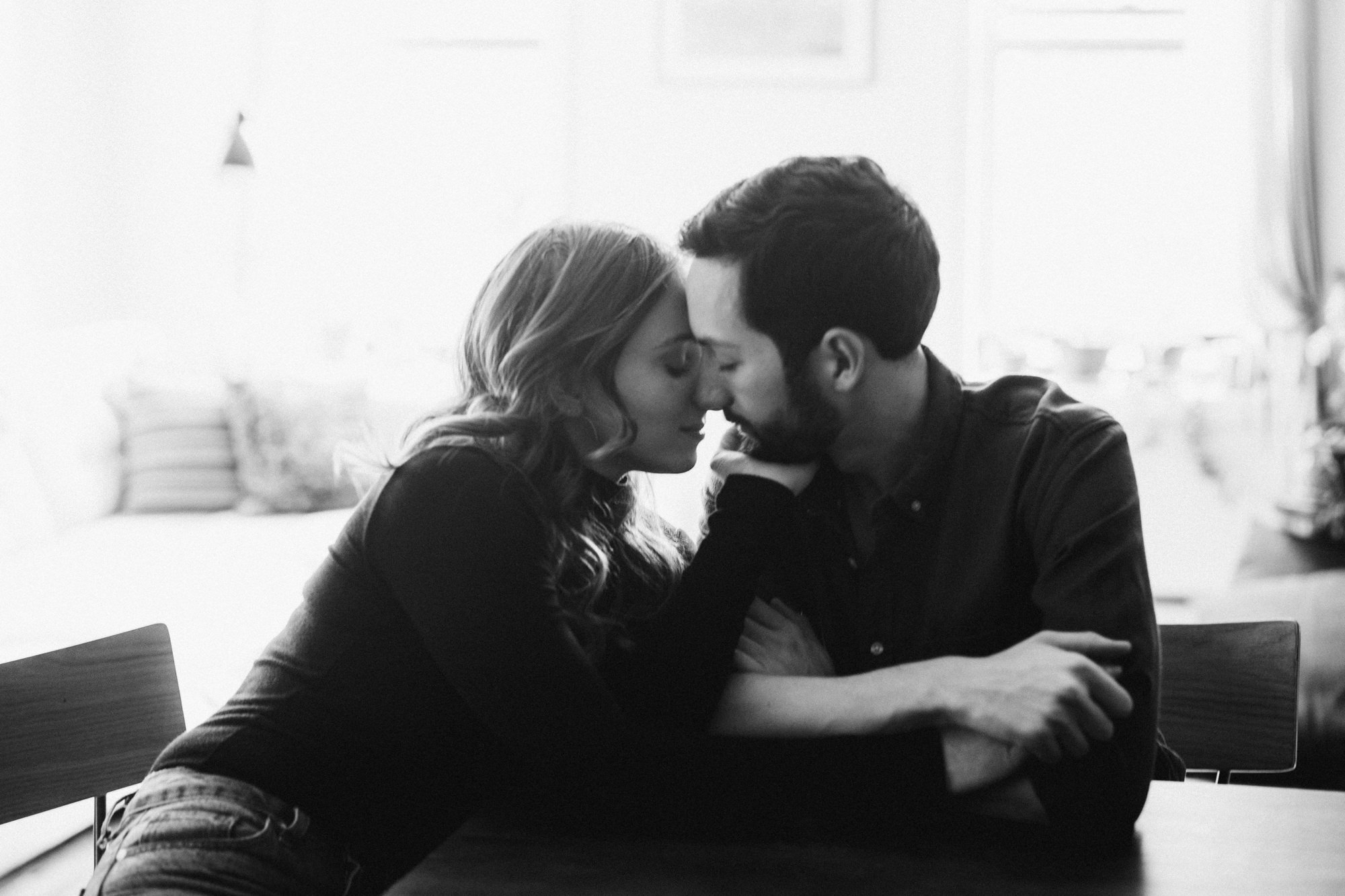 Close up of couple at kitchen table at home